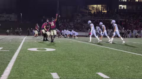 Uni Football Player Hand Up