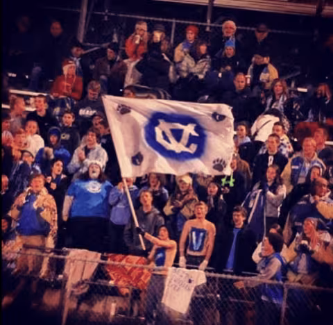 Audience with a flag showing the Central Valley Logo
